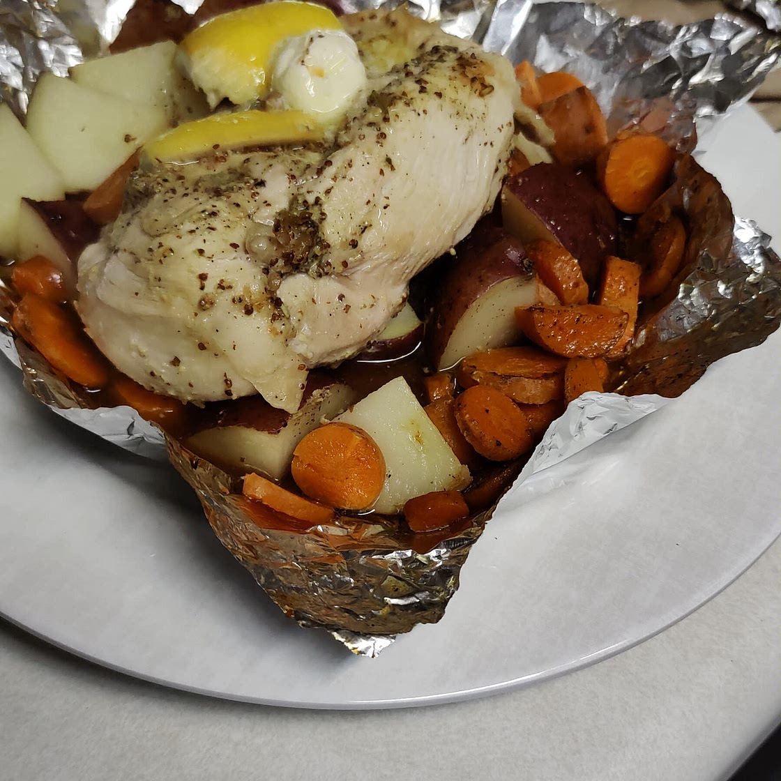 Easy Foil-Pack Lemon And Rosemary Chicken Dinner Recipe by Tasty