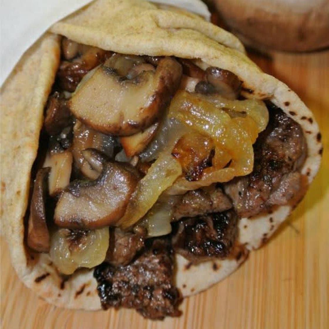 GREEK STEAK PITAS WITH CARAMELIZED ONIONS AND MUSHROOMS