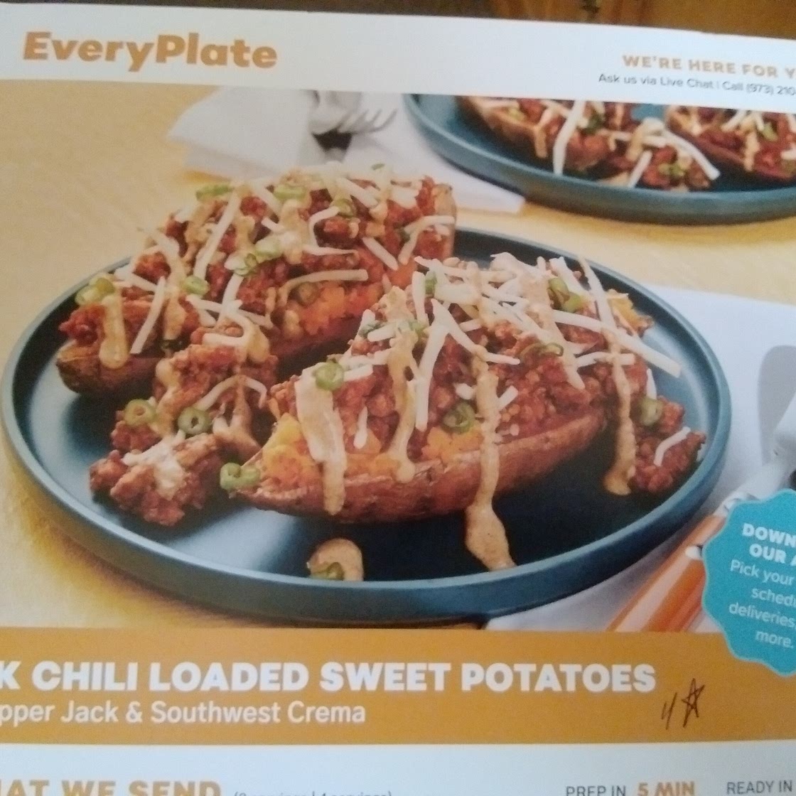 Pork Chili loaded sweet potatoes  with pepperjack & southwest crema