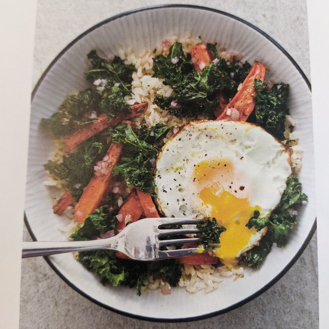 Brown rice bowls with roasted carrots, kale, and eggs