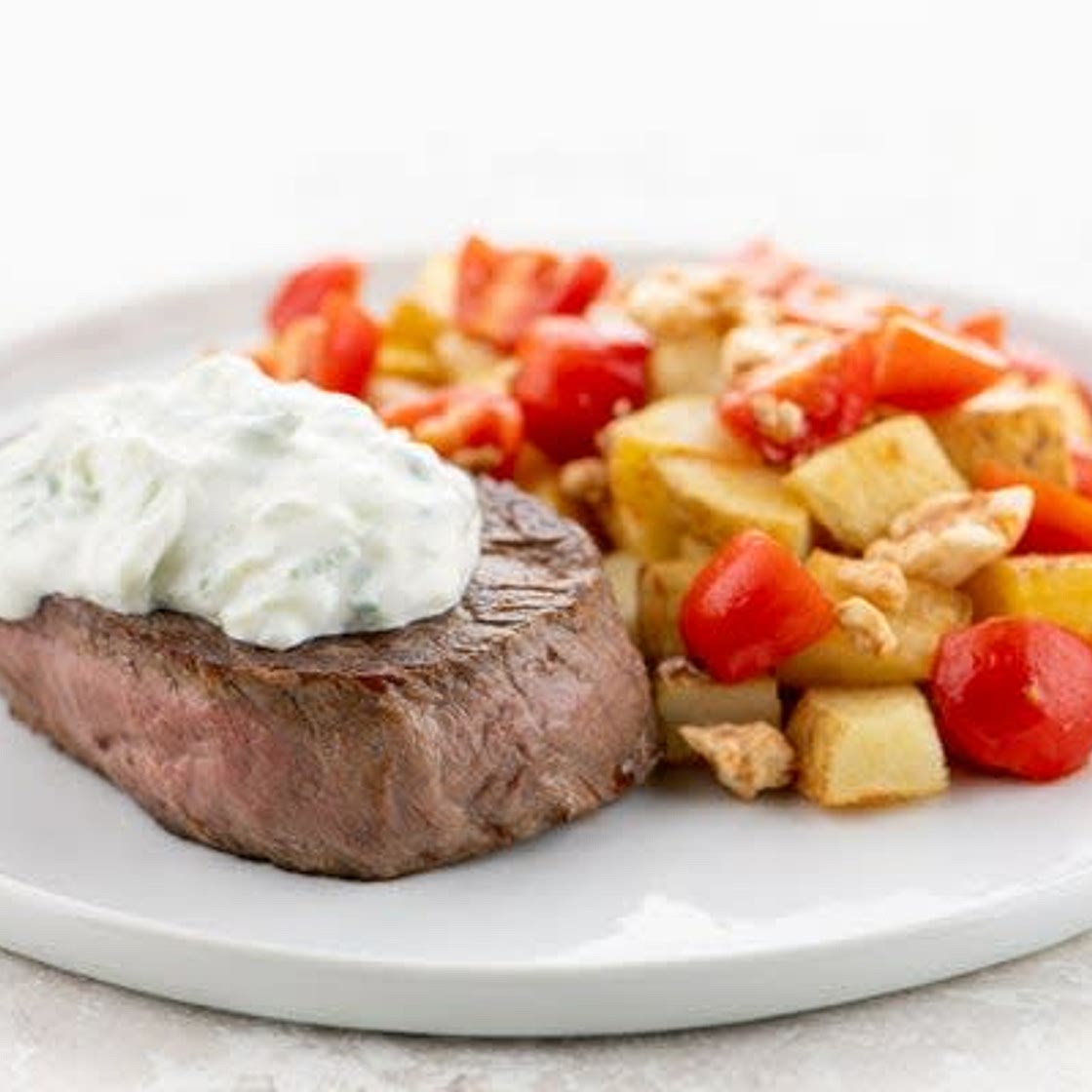 Mediterranean-Style Tzatziki Steak with potatoes and tomato relish