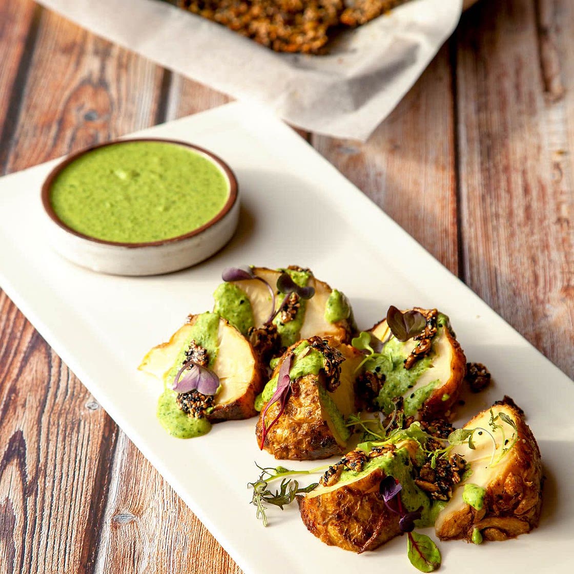 Slow roasted celeriac with green tahini sauce