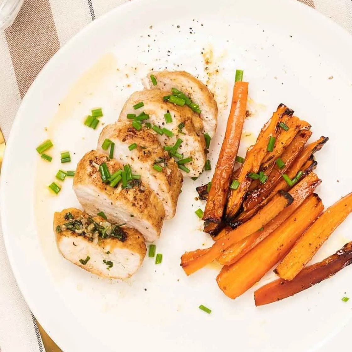 Roasted chicken breast with maple carrots