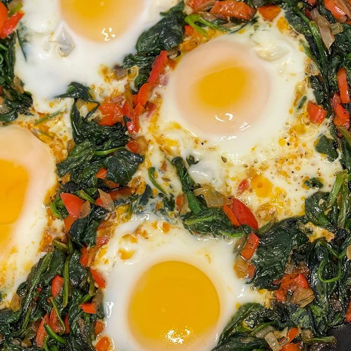 I’m not a breakfast person but when I do eat breakfast this is one of my favorite meals to have. I sautéed onion, red bell pepper and spinach together, seasoned it and cracked some eggs on top and done. It’s really simple and delicious and you can season i