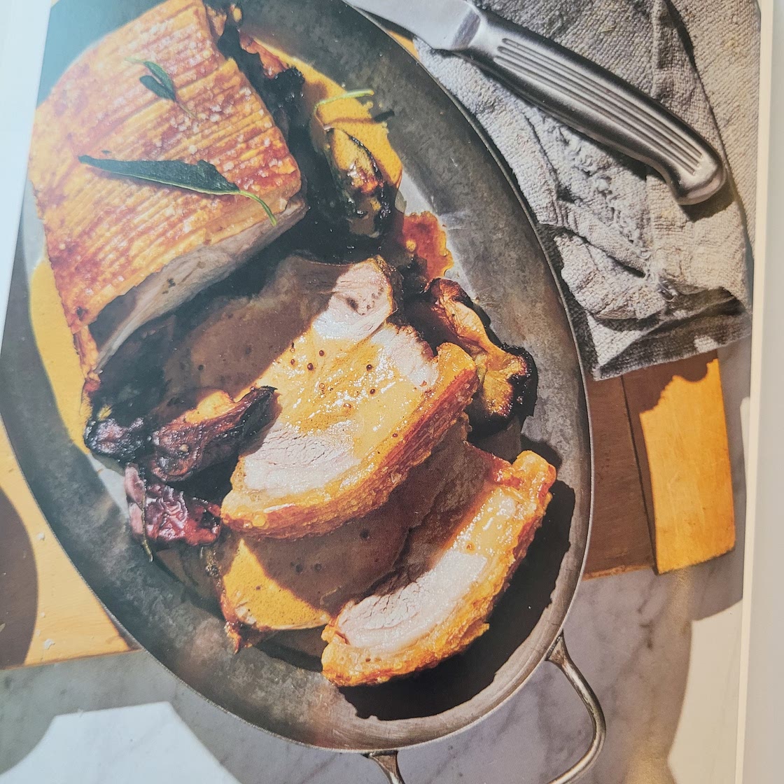 Whole roasted pork rack with caramelised apples and mustard