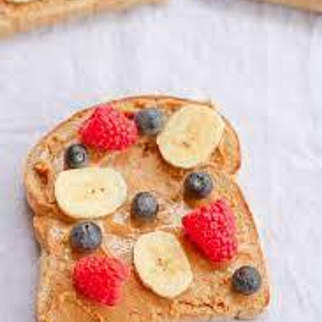 Peanut butter toast with berry compote