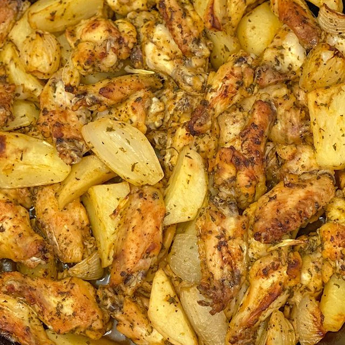 Oven baked wings with potatoes and onions