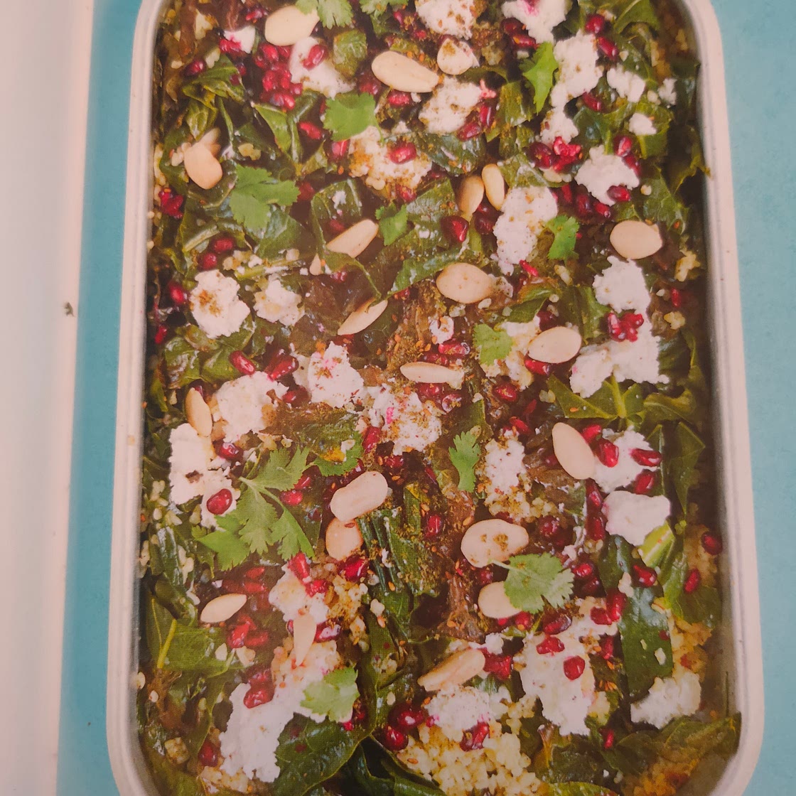 Crispy Kale and Bulghur Wheat Salad with Pomegranates, Preserved Lemon, Goat's Cheese and Almonds