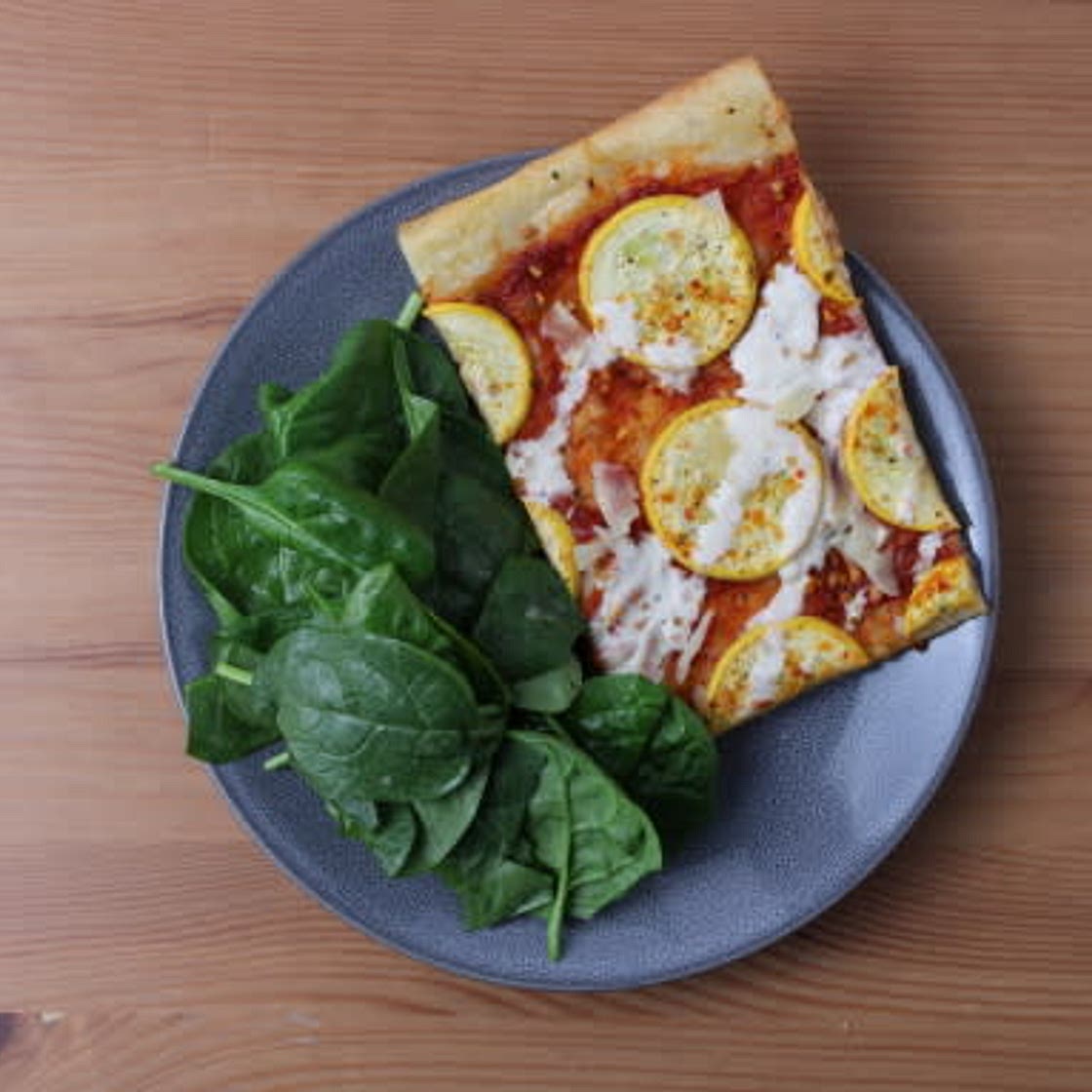 Zucchini & Parmesan Flatbread with Roasted Pepper Sauce & Spiced Labneh Drizzle