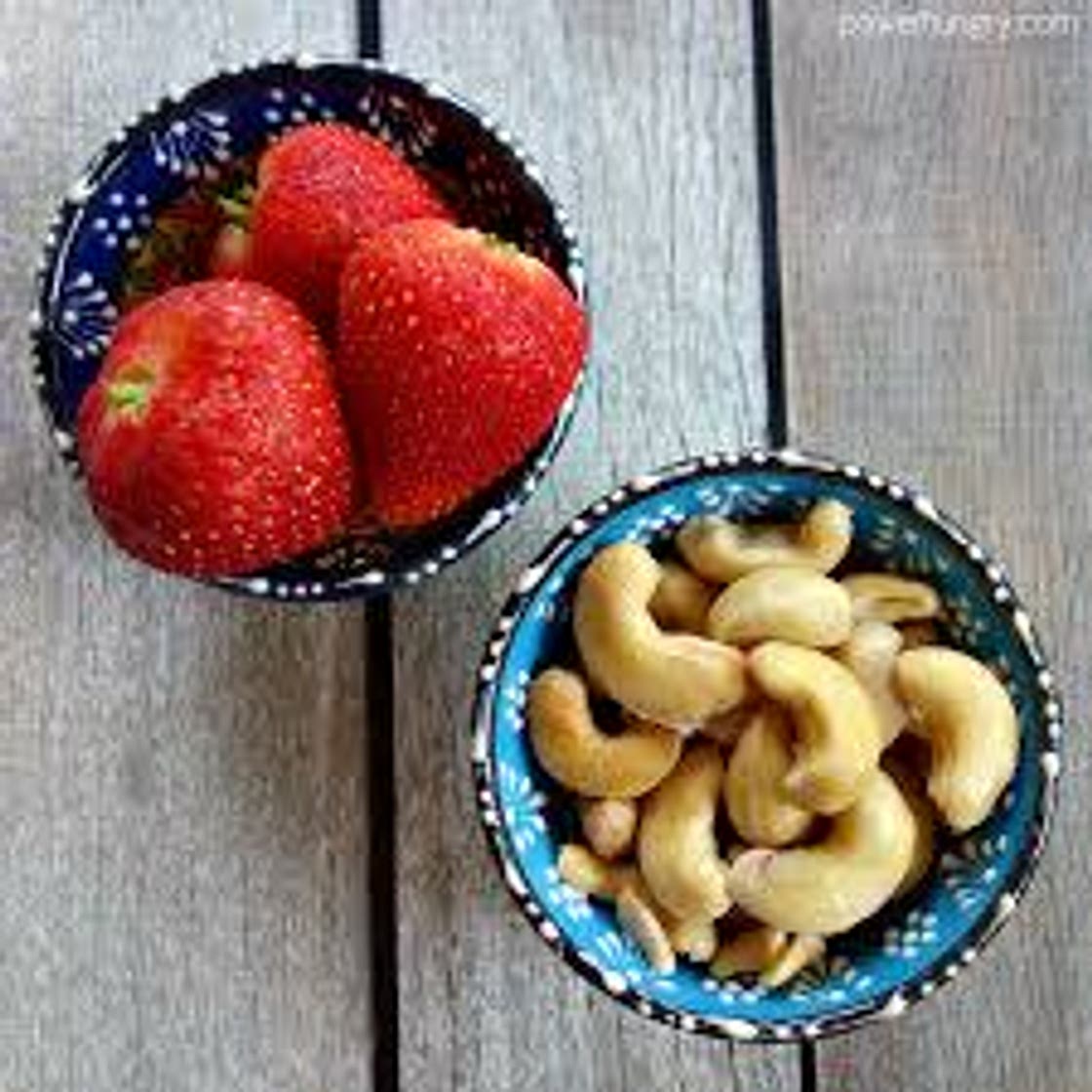 Raspberries or strawberries with cashews