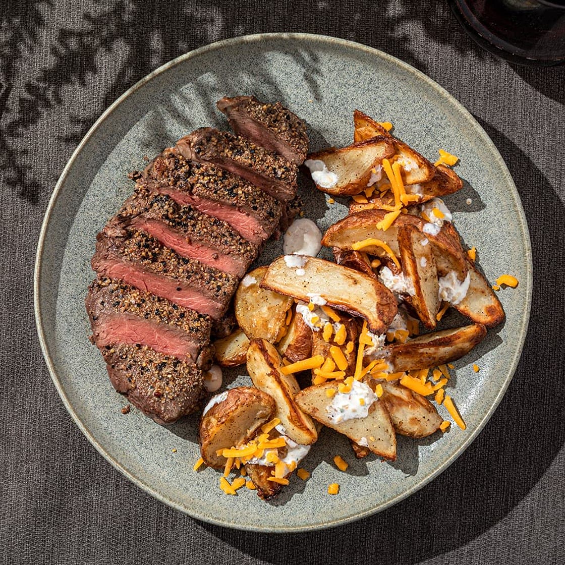 Garlic Pepper Steak and Loaded Potato Wedges with Cheddar & Bacon Sour Cream