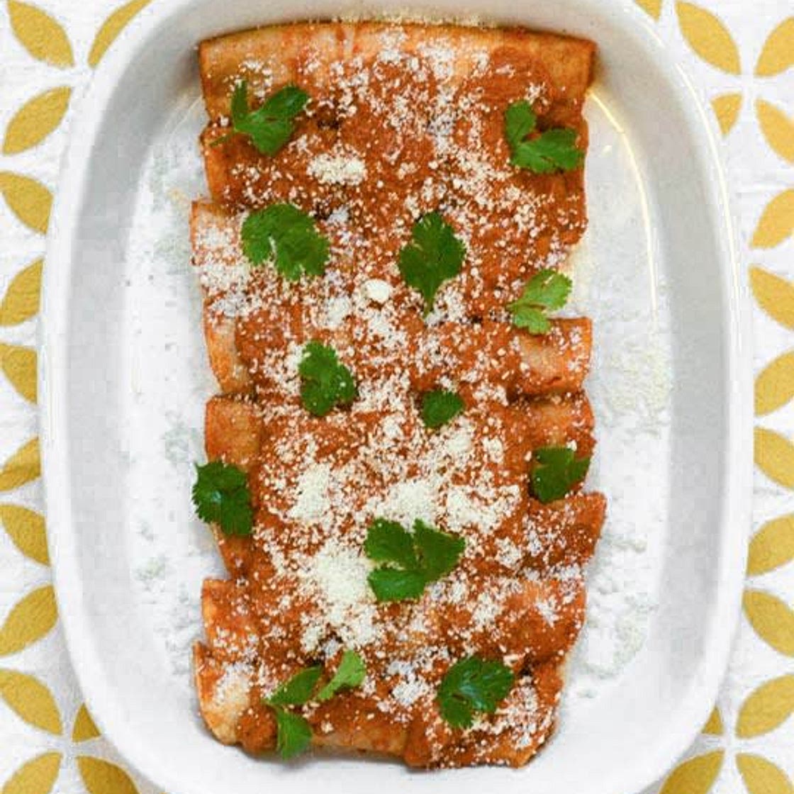 RED ENCHILADAS STUFFED WITH POTATOES, GREENS & PUMPKIN SEEDS