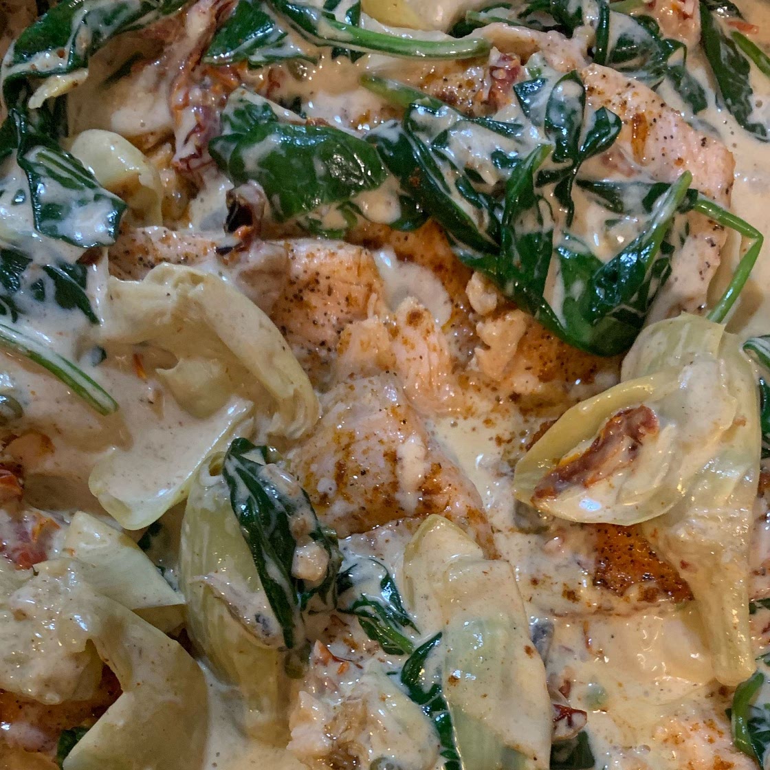 Creamy Tuscan Salmon with Spinach, Artichokes, and Garlic