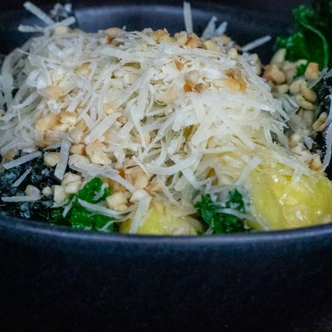 Gnocchi with kale, parmesan, lemon and toasted hazelnuts
