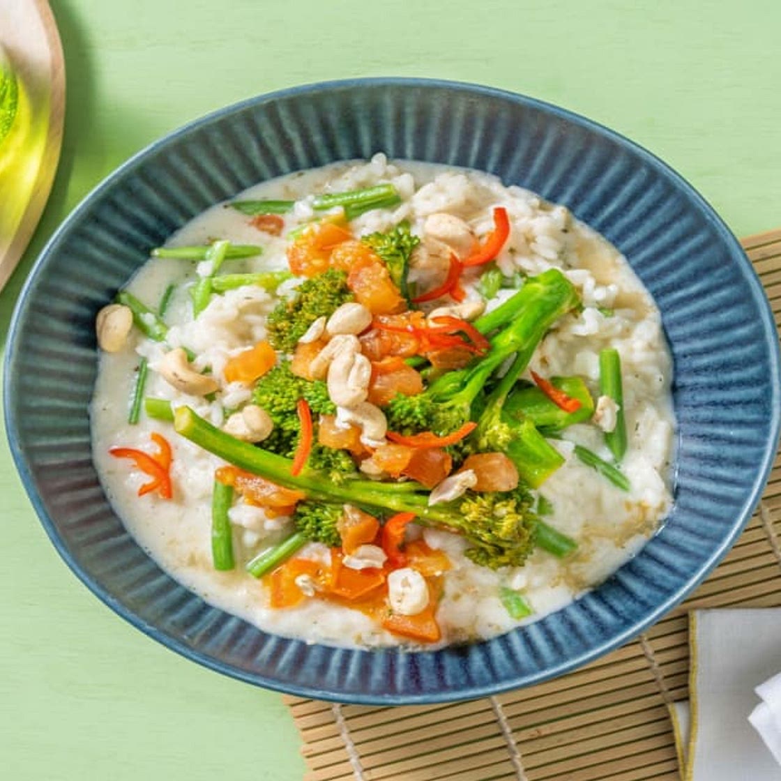 Cremiges Risotto mit Brokkolini & grünen Bohnen Bei diesem Gericht wird 50% weniger CO2e durch Zutaten & Transport verursacht als bei einem durchschnittlichen HelloFresh Rezept