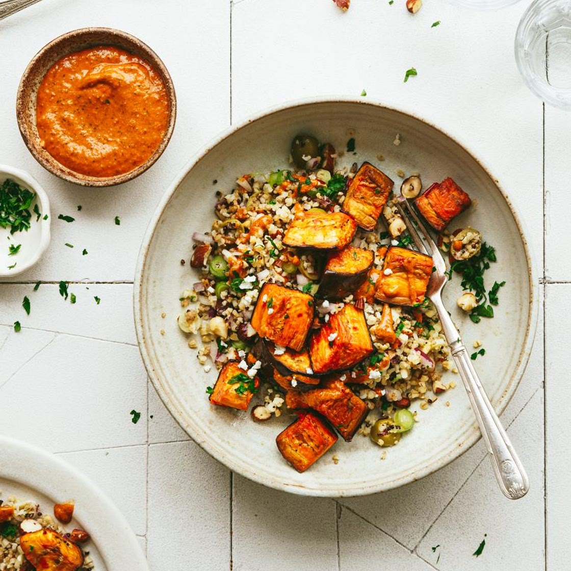 Roast aubergine with mixed grains and red pepper sauce