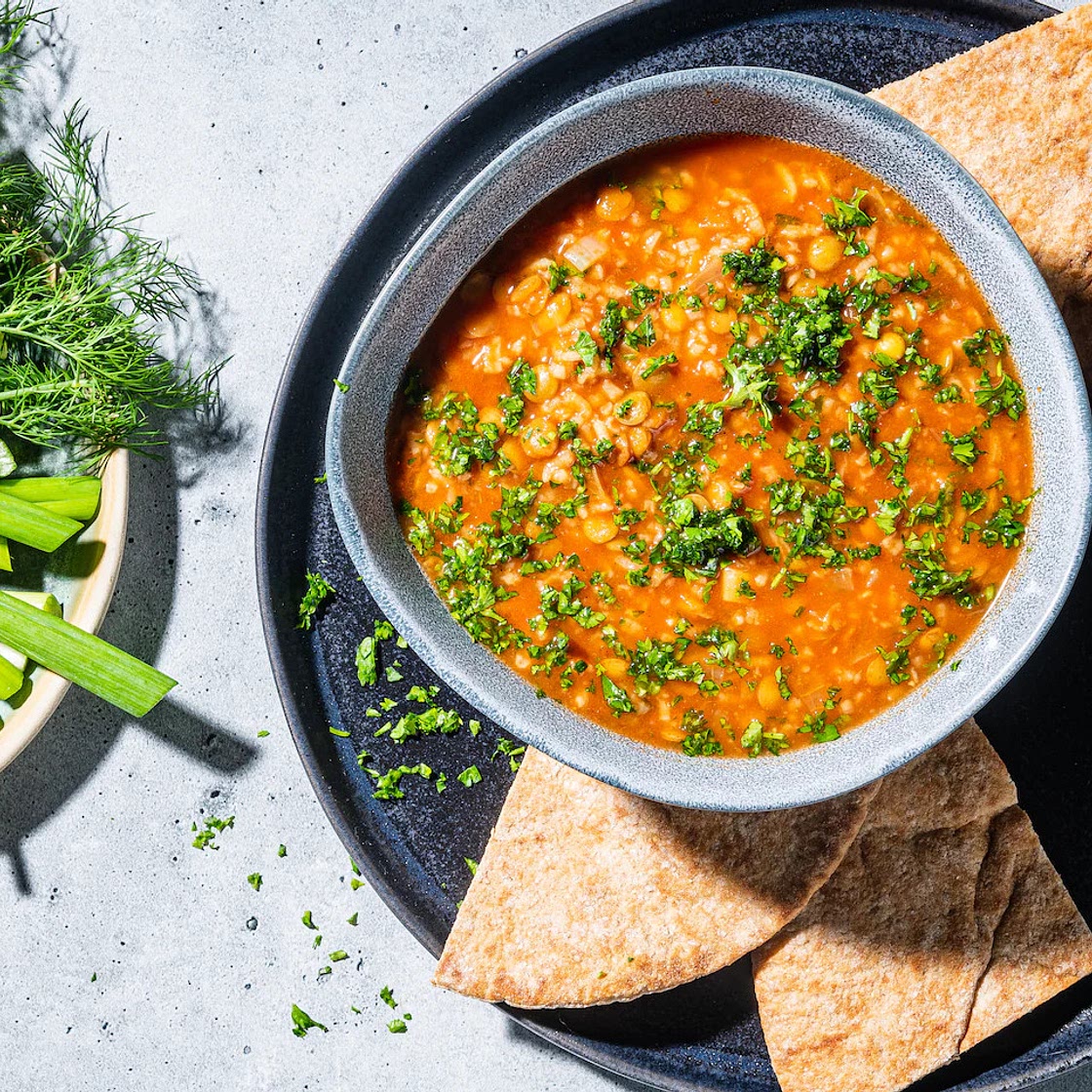 Hearty tomato-lentil soup is warm, tangy and filled with Persian flavors