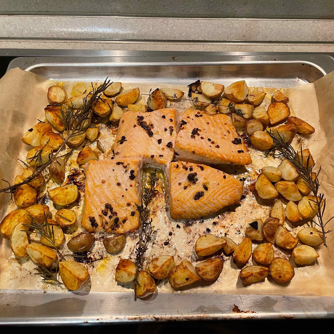 One Sheet-Pan Garlic Butter Salmon + Red Potatoes