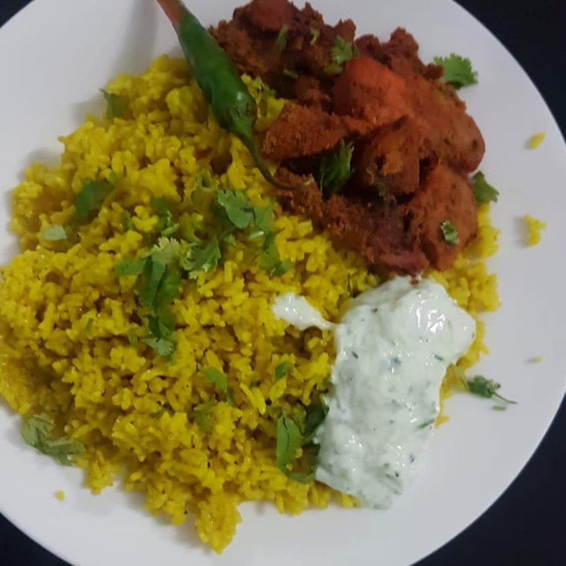 Delicious and super easy tandoori Chicken with yellow rice and a cucumber yogurt sauce, my family’s favorite….. —Tandoori Chicken— : -3 large chicken breasts (cut into 1 inch bite size pieces) -1/4 cup of olive oil -1 tablespoon ginger (fresh or paste) -3