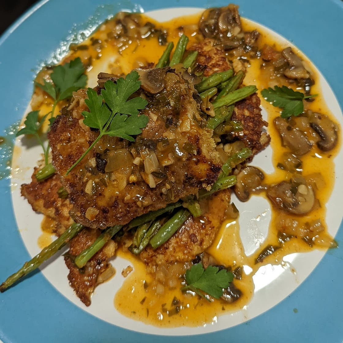 Panko Cod with Truffle Mushroom Sauce served over Cauliflower Fritters and Green Beans