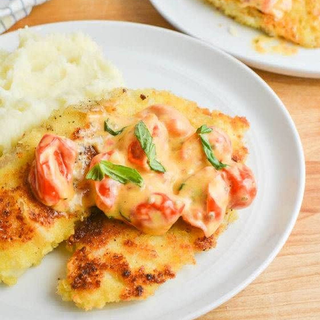 Parmesan Crusted Tilapia with Tomato-Basil Cream Sauce
