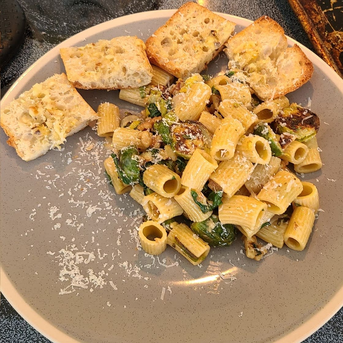 Roasted Garlic Cream Rigatoni with Brussels Sprouts with walnuts and garlic bread