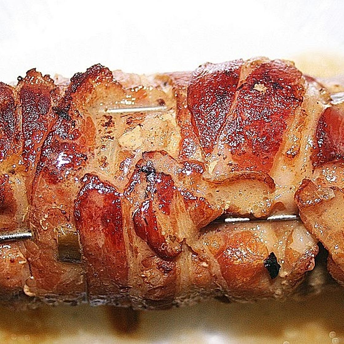 Schweineroulade mit Pilz - Käsefüllung und Baconhülle