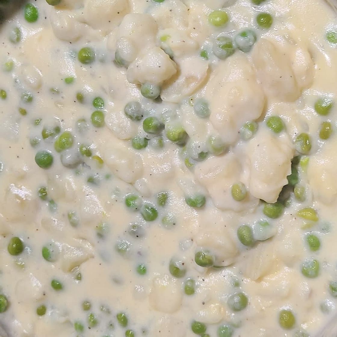 Old Fashioned Creamed New Potatoes and Peas in a White Sauce