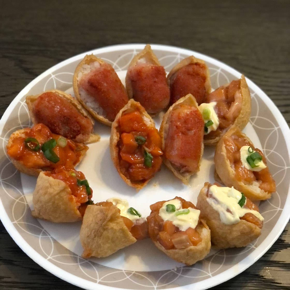 Inari sushi with salmon sashimi & pollock roe toppings