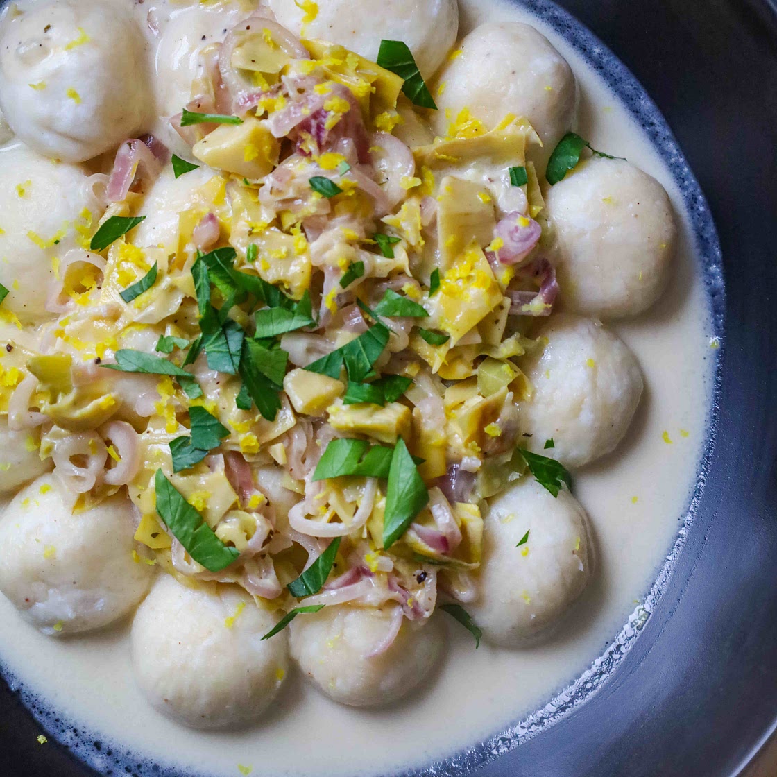 Ricotta Gnudi with Creamy Shallots and Artichokes