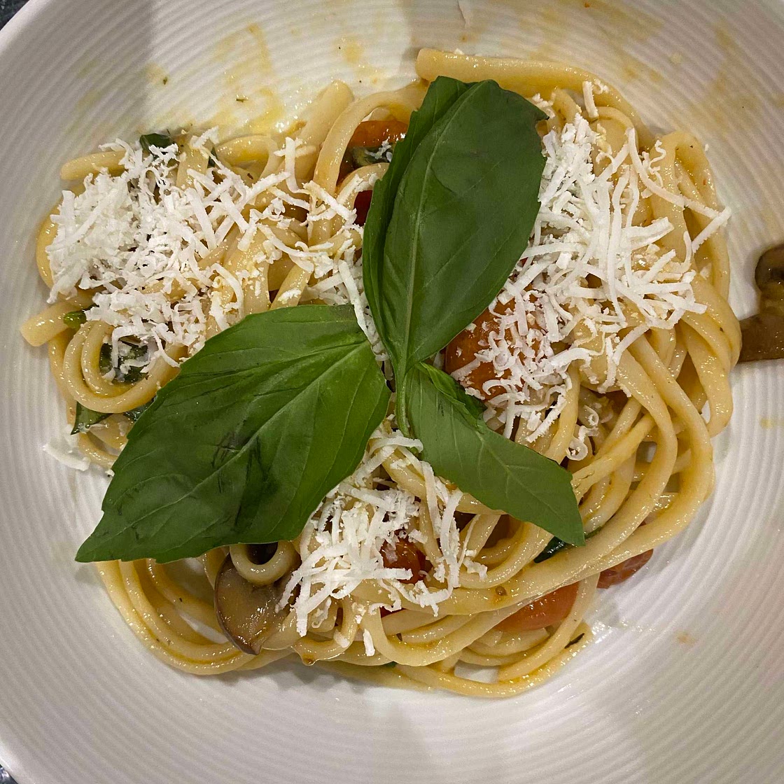 Confit cherry tomato and garlic pasta with mushrooms