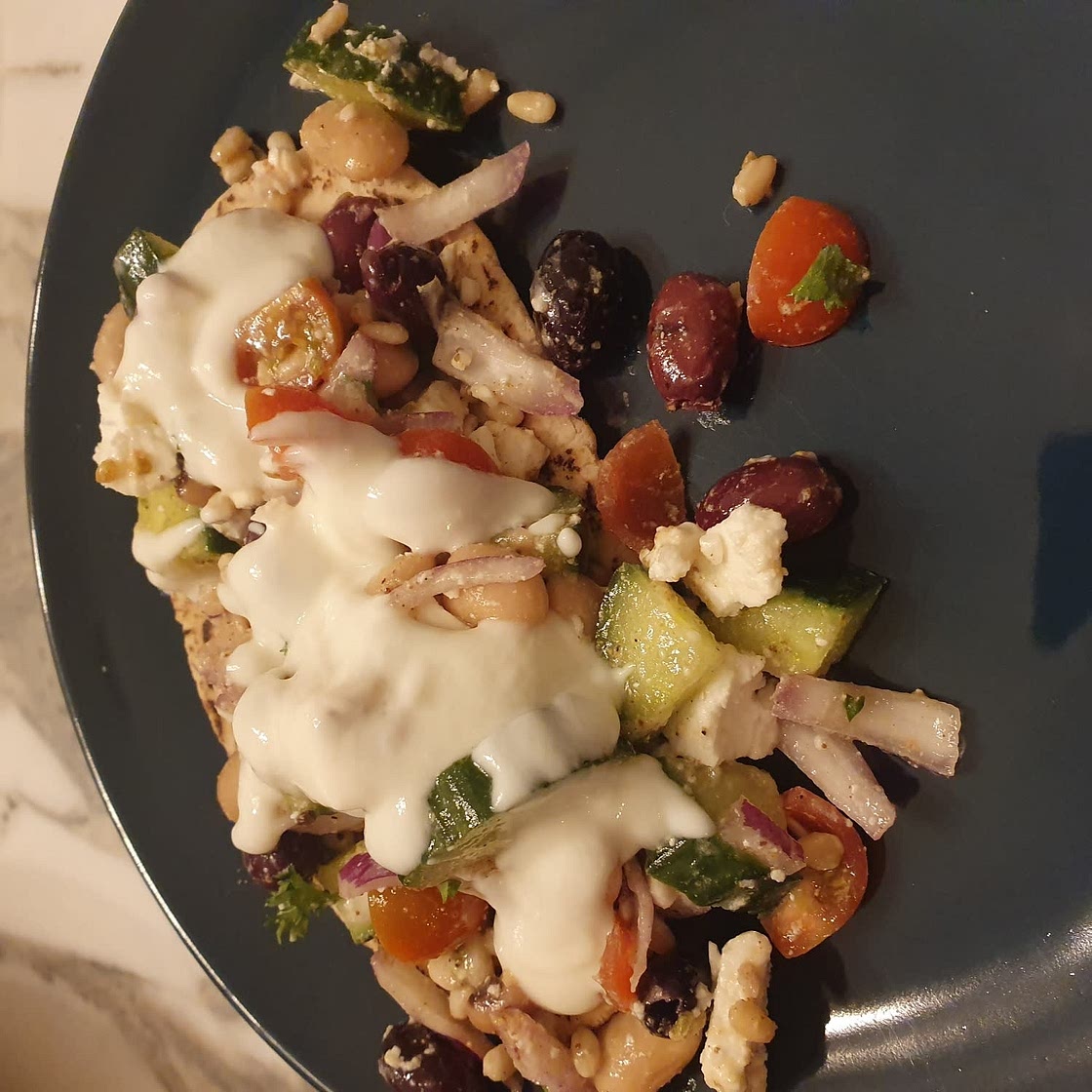 Greek salad wraps with white beans and garlic yogurt