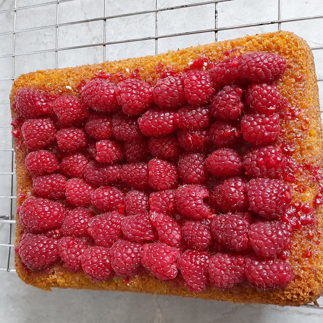 Easy Lemon Drizzle Cake with raspberry topped glaze