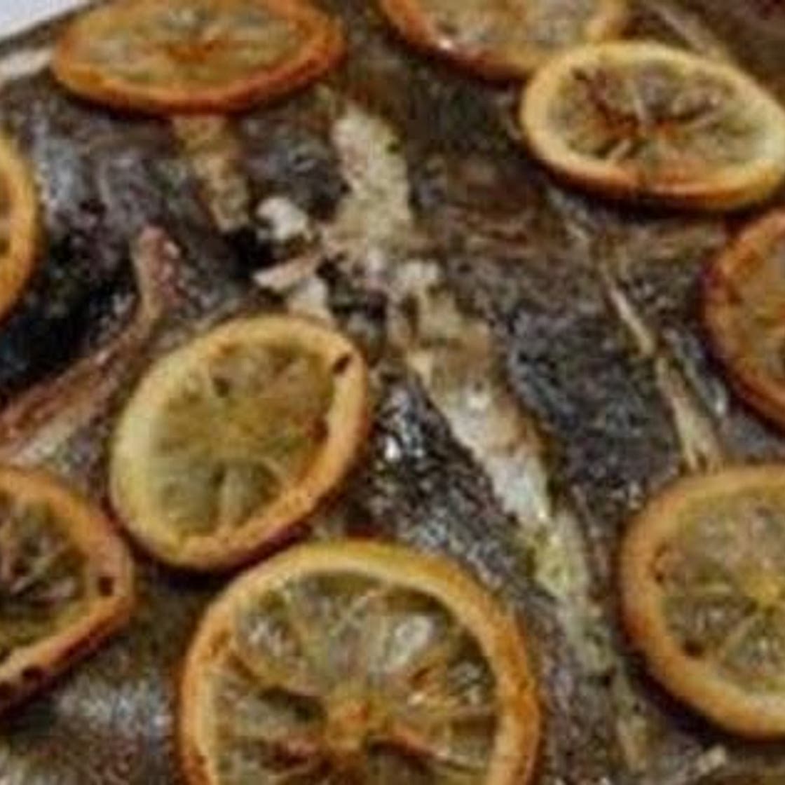 Whole baked turbot with lemon and herbs