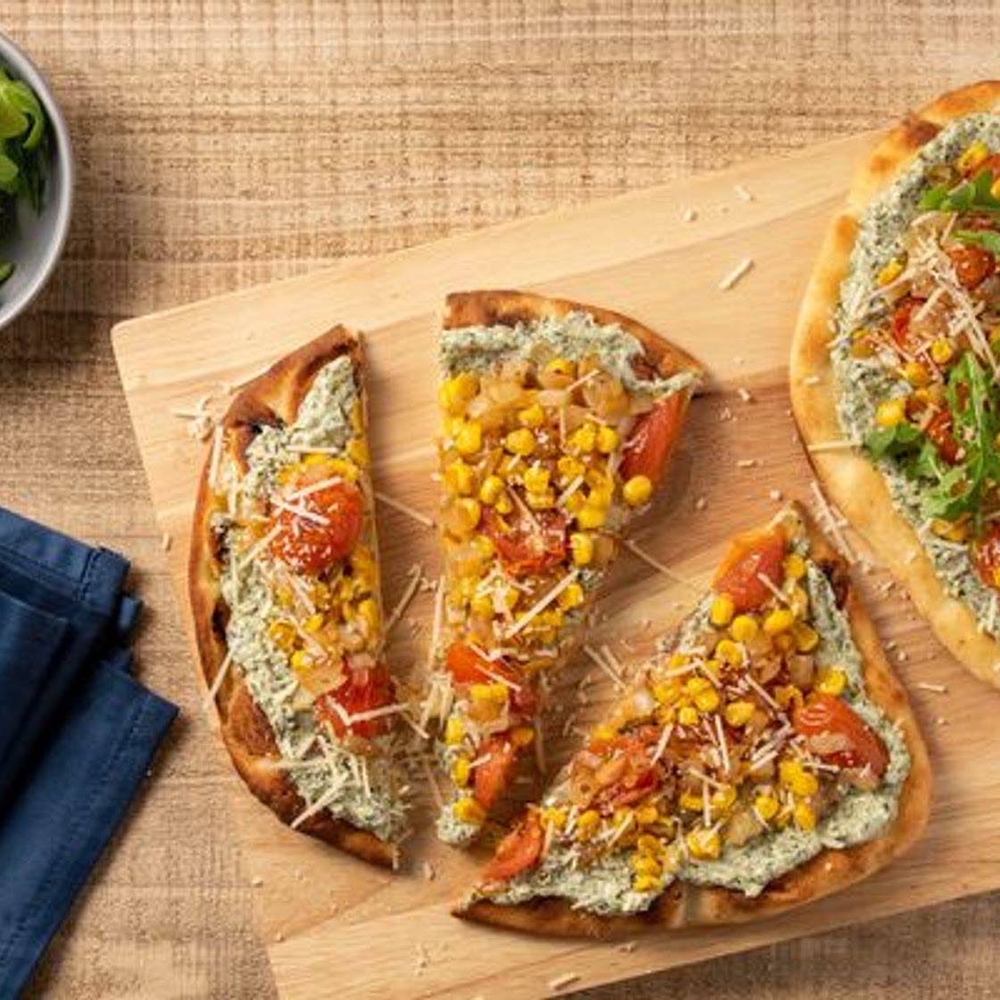 Basil Ricotta and Vegetable Flatbread with corn and arugula