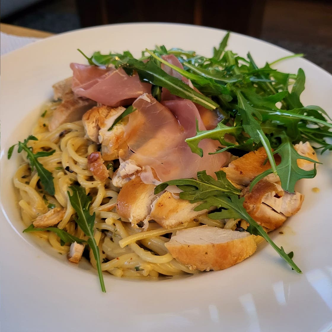 Basil Parmesan Pasta with Crispy Chicken, Prosciutto, and Arugula