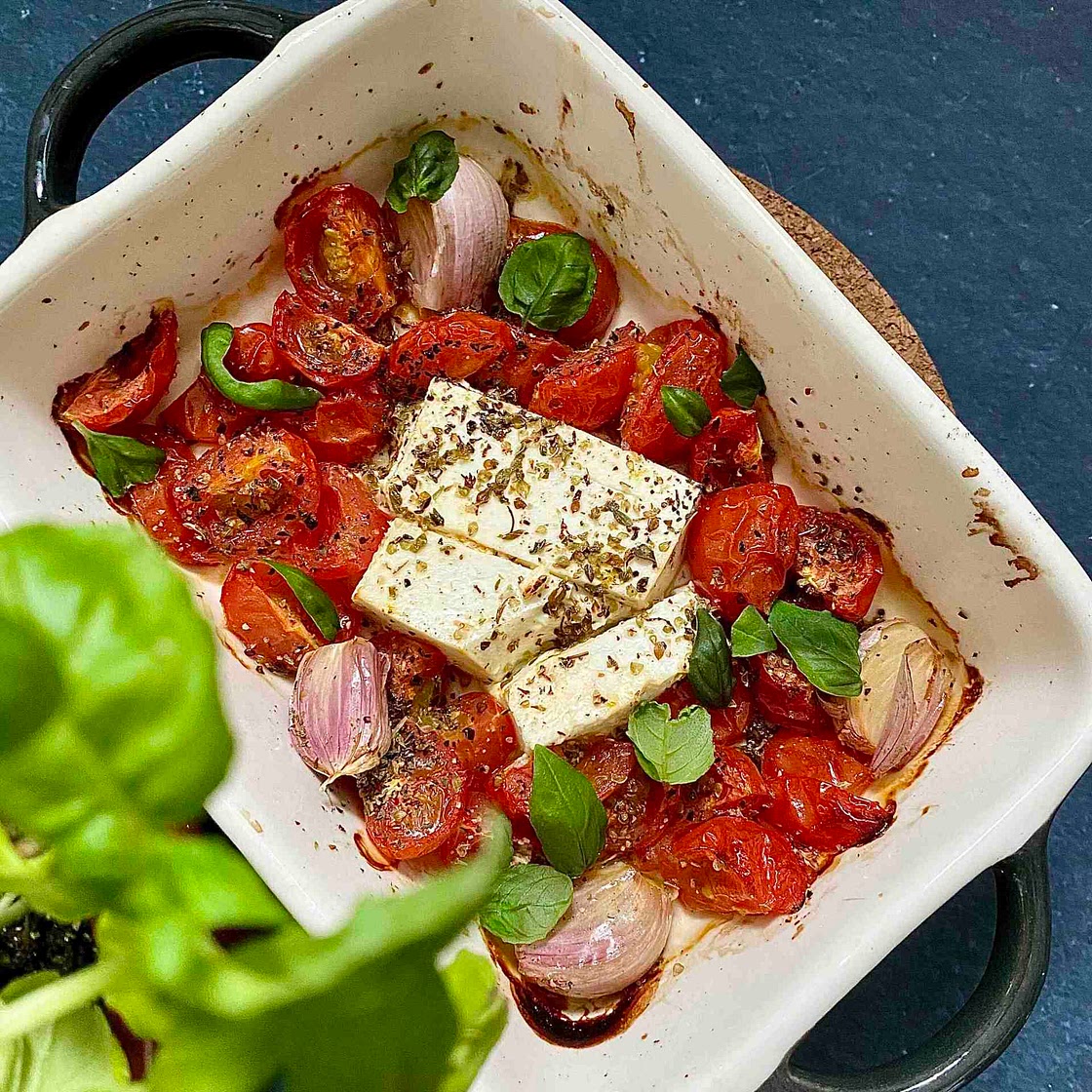 Oven baked white cheese with cherry tomatoes