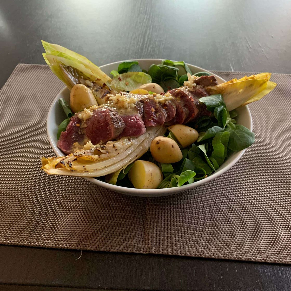Warm potato, chicory and steak salad