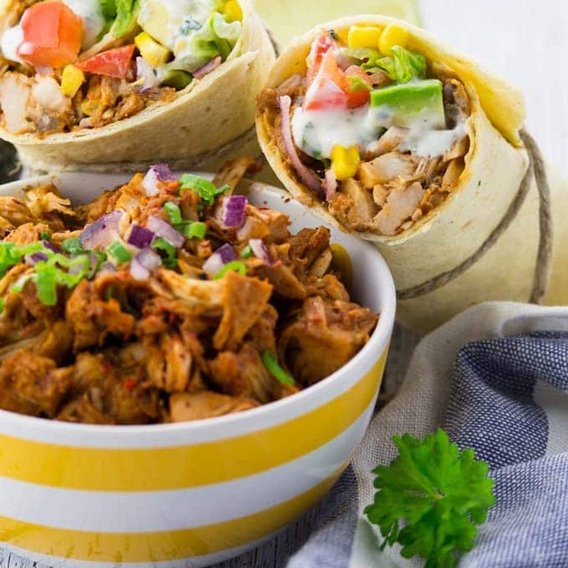 Vegan pulled pork wrap with sauce sage, spinach & tomato