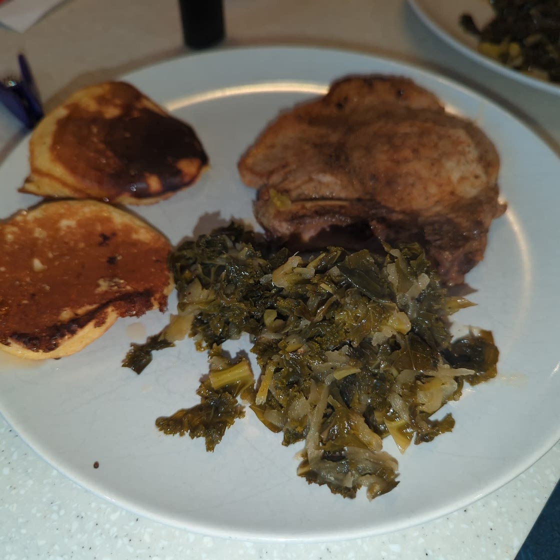 Southern Pork Chops & Crispy Corn Cakes with Braised Apple & Kale