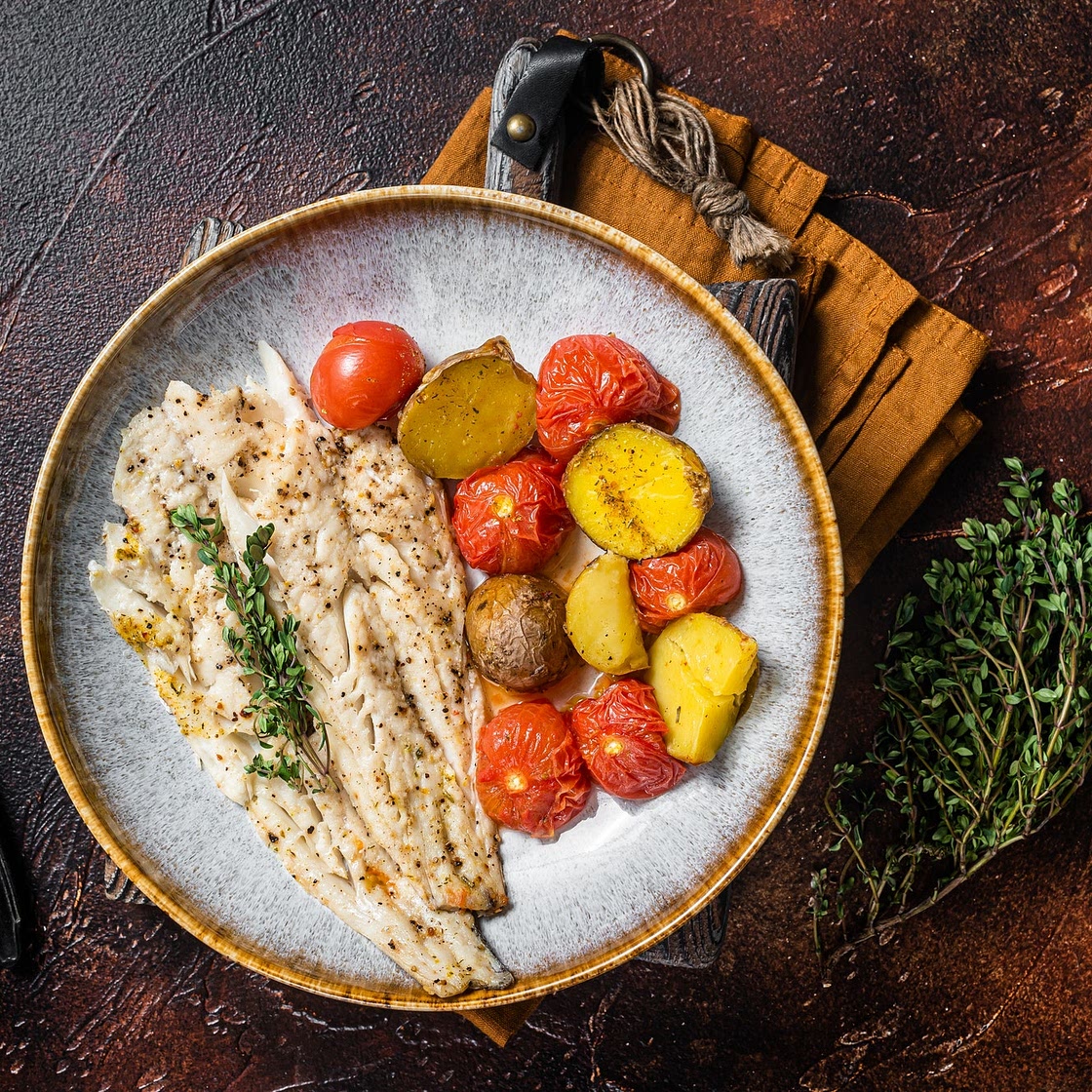 Appetizing Baked Haddock With Tomatoes, Olives and Caperberries