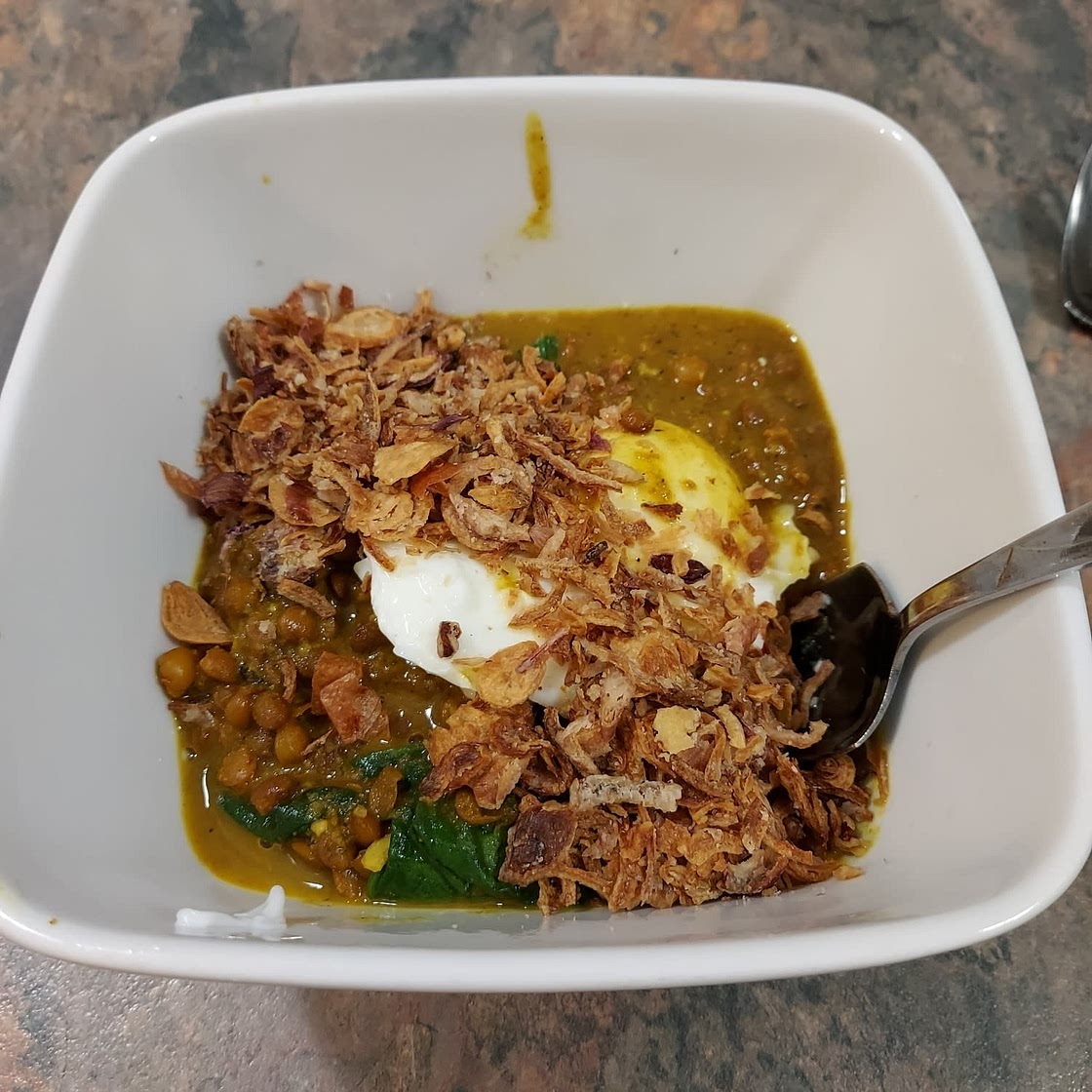 GREEN LENTIL SPINACH DAAL WITH POACHED EGG AND CRISPY ONIONS