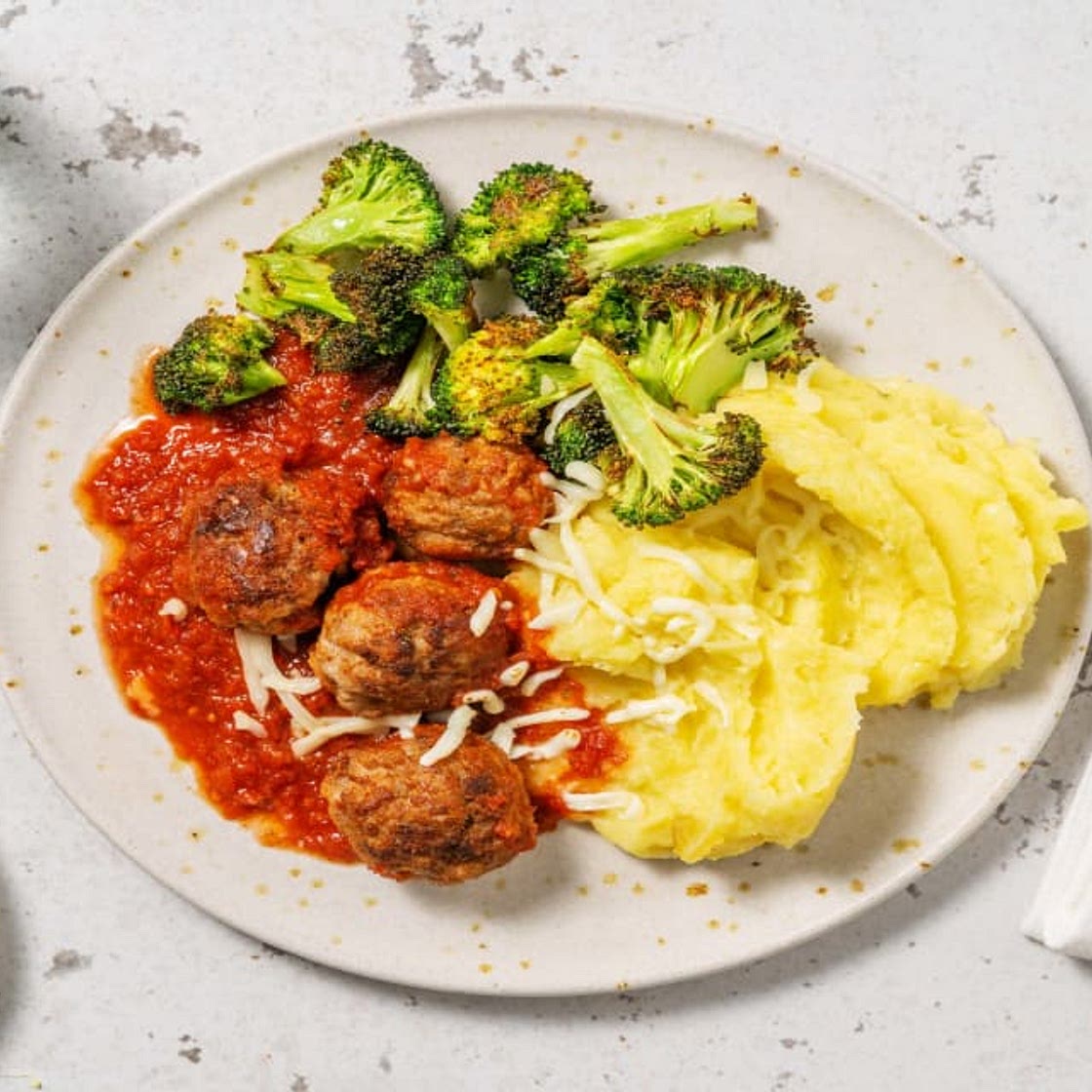 Pork Meatballs in Cajun Tomato Sauce with Cheesy Mash and Roasted Broccoli