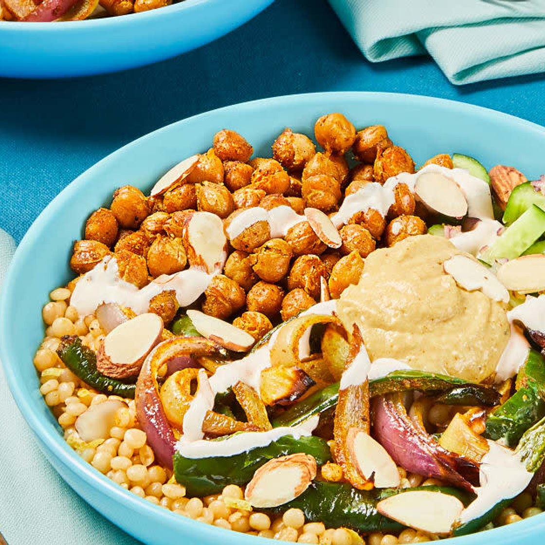 Crispy Chickpea Couscous Bowls
with Poblano, Hummus & Lemon Crema