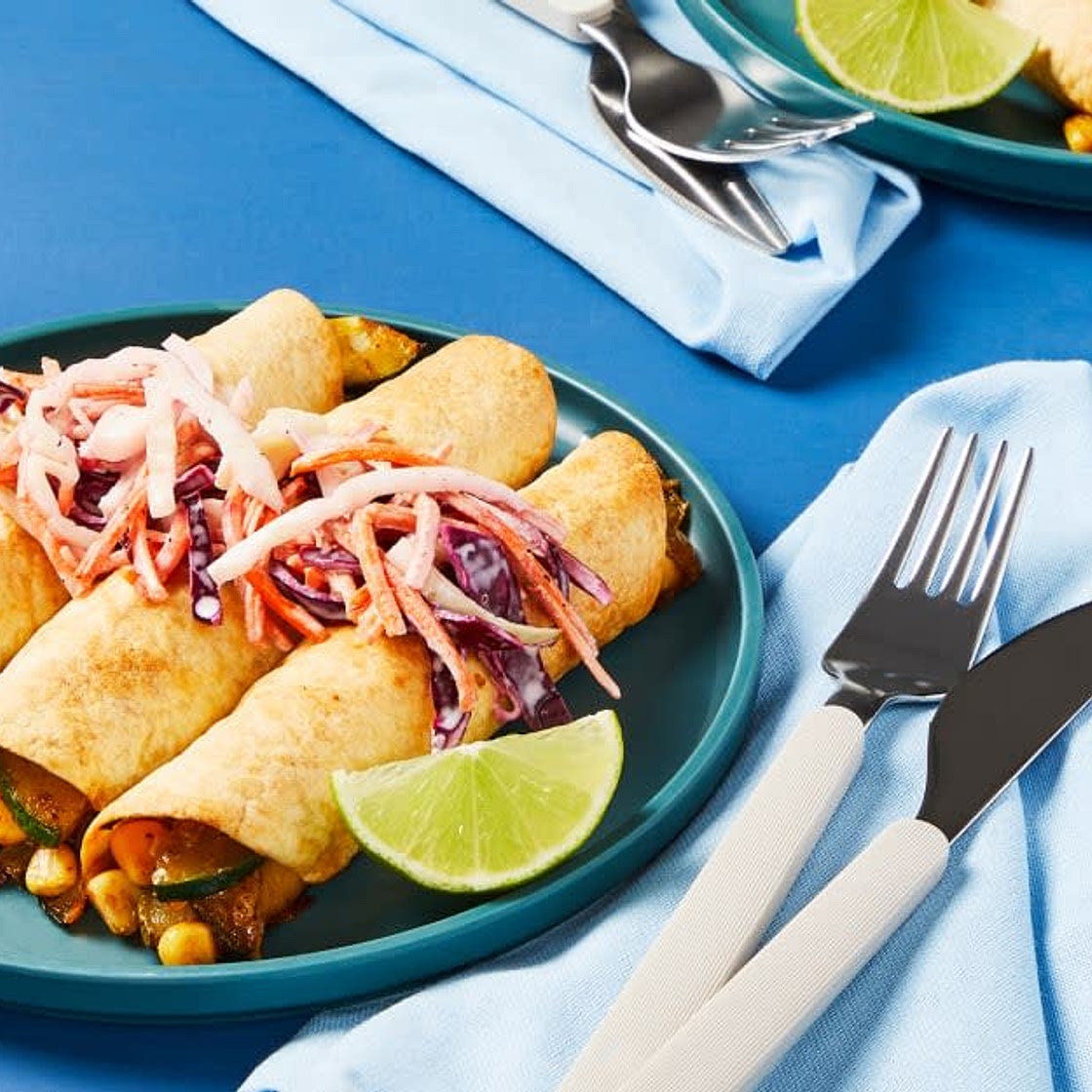 Cheesy Zucchini Flautas
with Cabbage Slaw