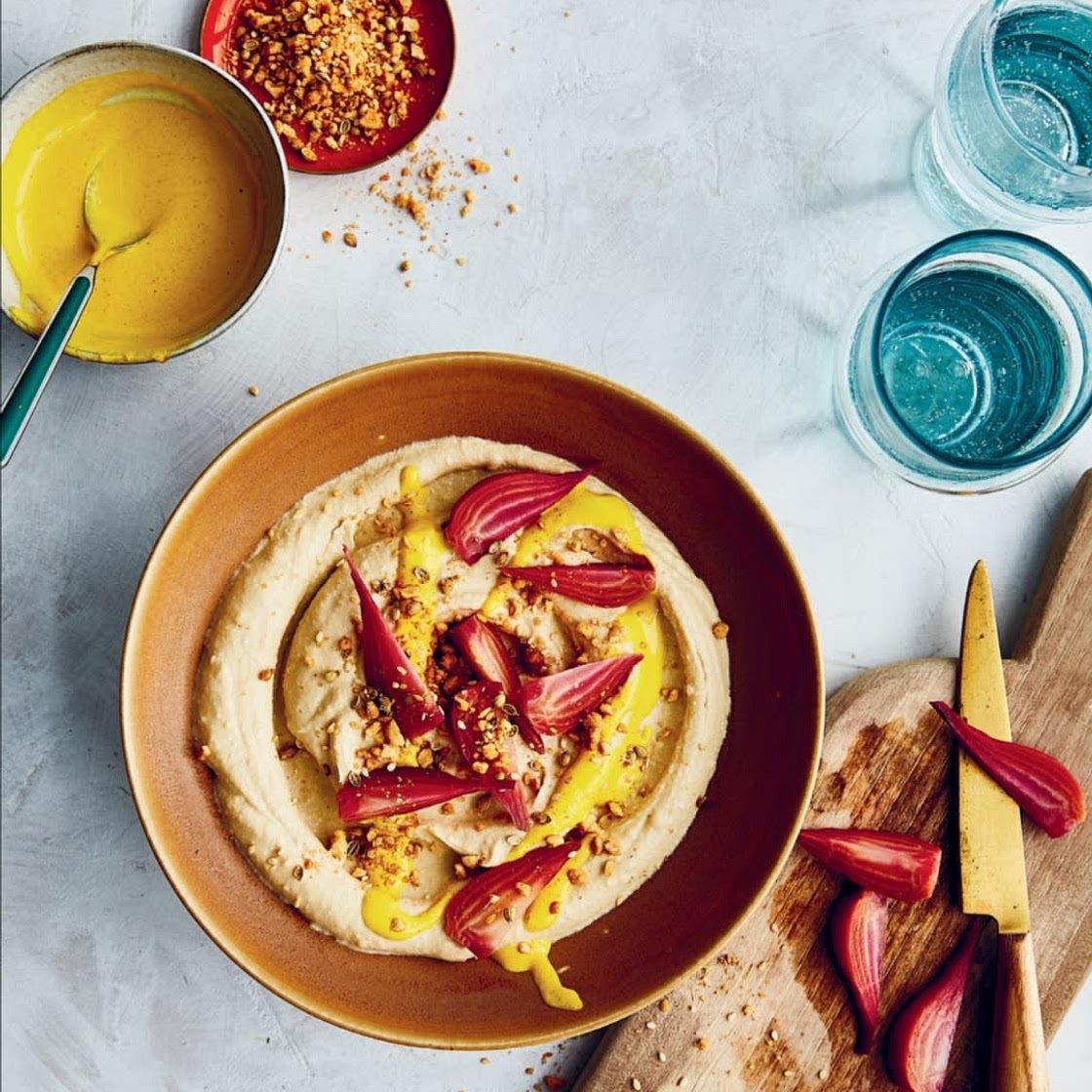 ROASTED BEET HUMMUS BOWL WITH TURMERIC TAHINI AND PEANUT DUKKAH