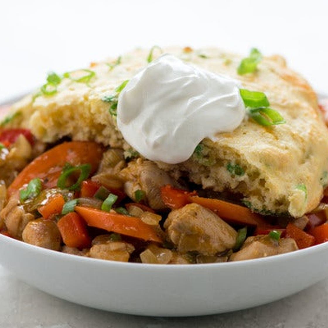 Cajun Chicken Thigh Cornbread Pie with sour cream and red bell pepper