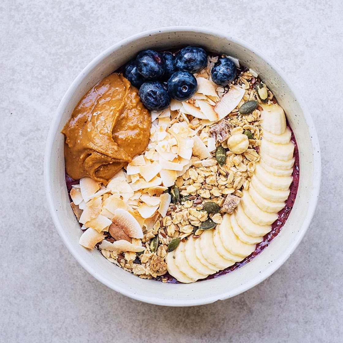 Açai bowl with blueberries, granola, banana and peanutbutter