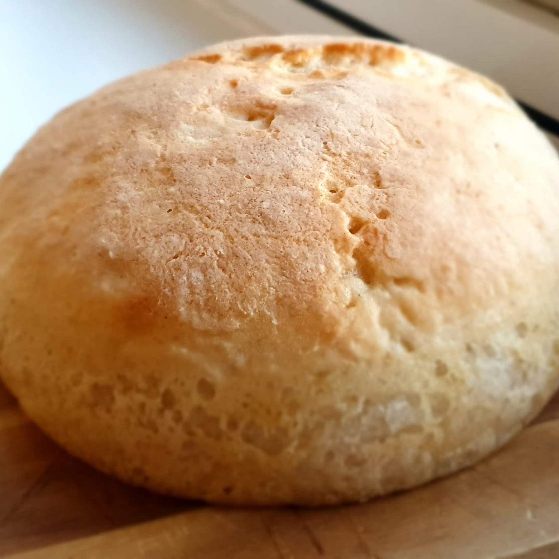 Fluffy gluten free sourdough bread with those magnificent holes!