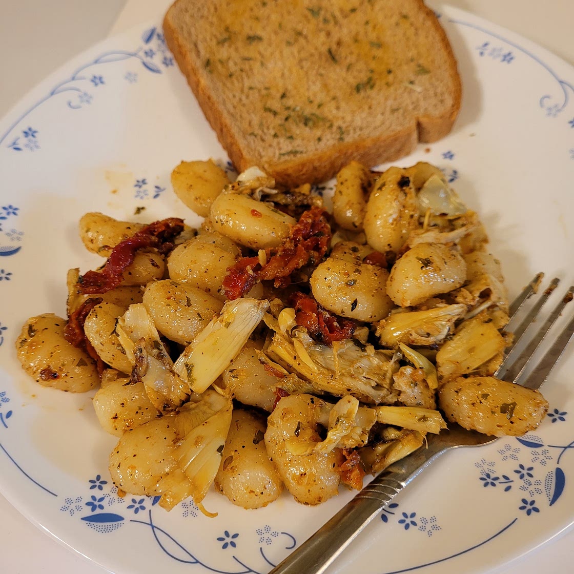 Sauted artichoke hearts with sun dried tomatoes and gnocchi